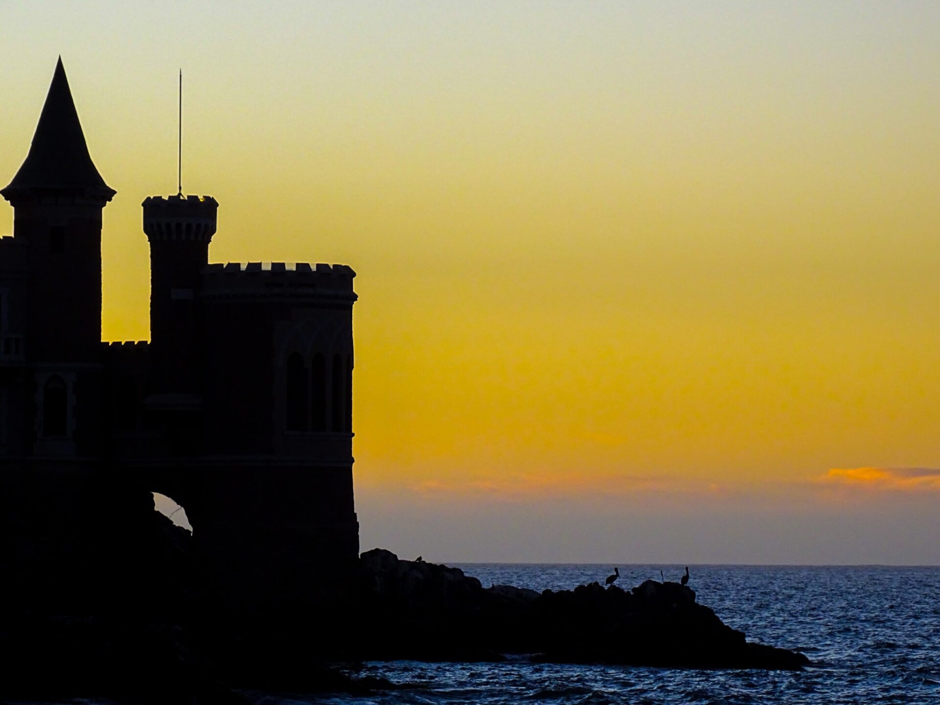 Silhouette of Wulff Castle at sunset overlooking the Pacific Ocean in Viña del Mar, Chile