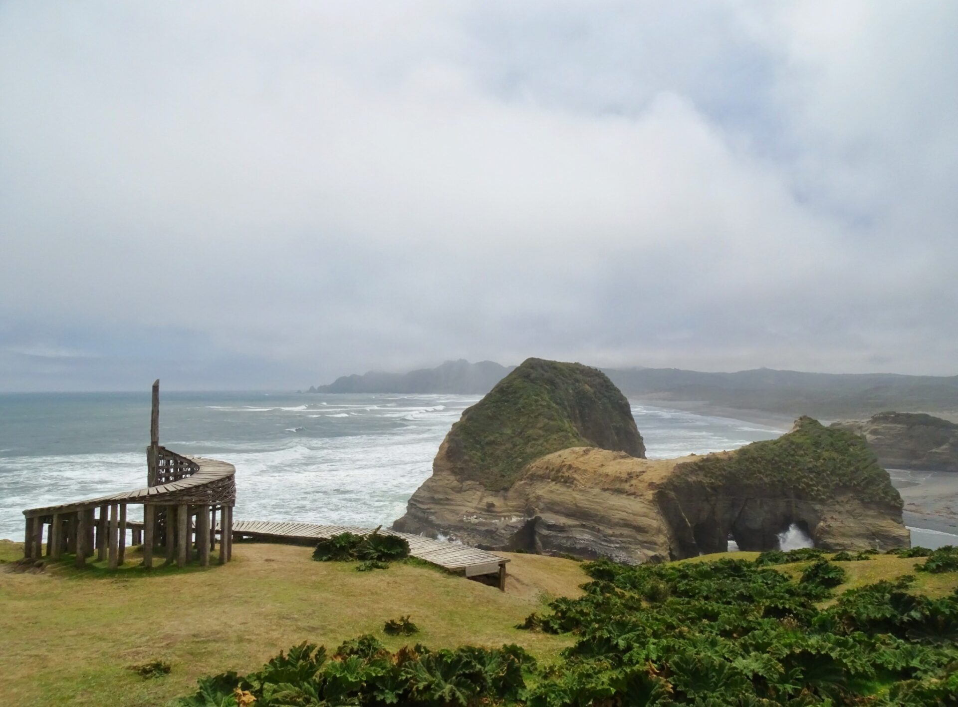 Coastal rock formations and ocean cliffs at Muelle del Tiempo, Chiloé Island, Chile