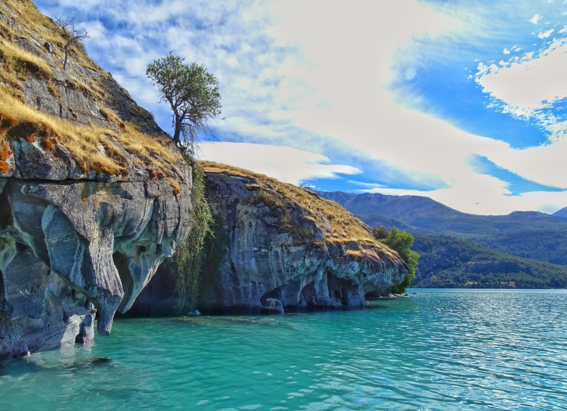 Marble Caves rising above turquoise waters along the shoreline of Patagonia.